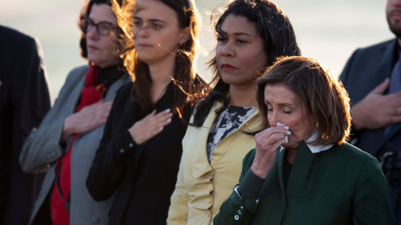 Mourners, including her daughter Katherine Feinstein, left, San Francisco Mayor London Breed, second from right, and U.S. Rep. Nancy Pelosi, D-Calif., gather at San Francisco International Airport to receive the body of U.S. Sen. Dianne Feinstein, D-Calif., Saturday, Sept. 30, 2023, in San Francisco.