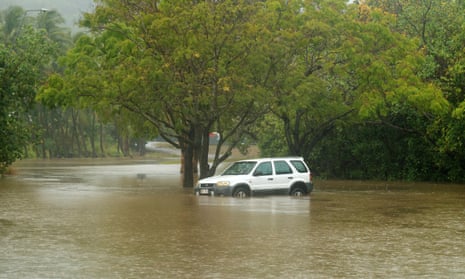 A car inundated with water nearby the Barron River in Cairns