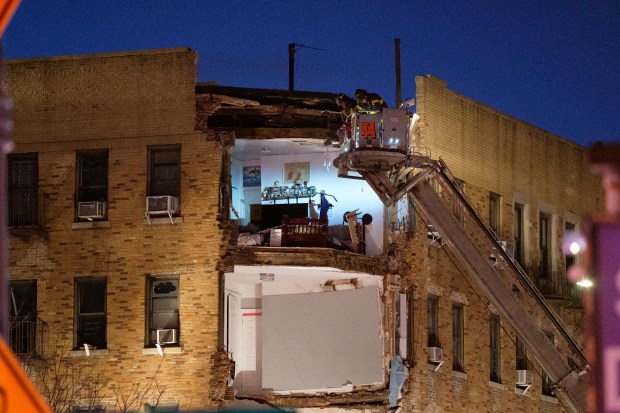 Firefighters respond to a partial building collapse on West Burnside Avenue and Phelan Place in the Bronx, New York City on Monday, December 11, 2023. (Gardiner Anderson for New York Daily News)