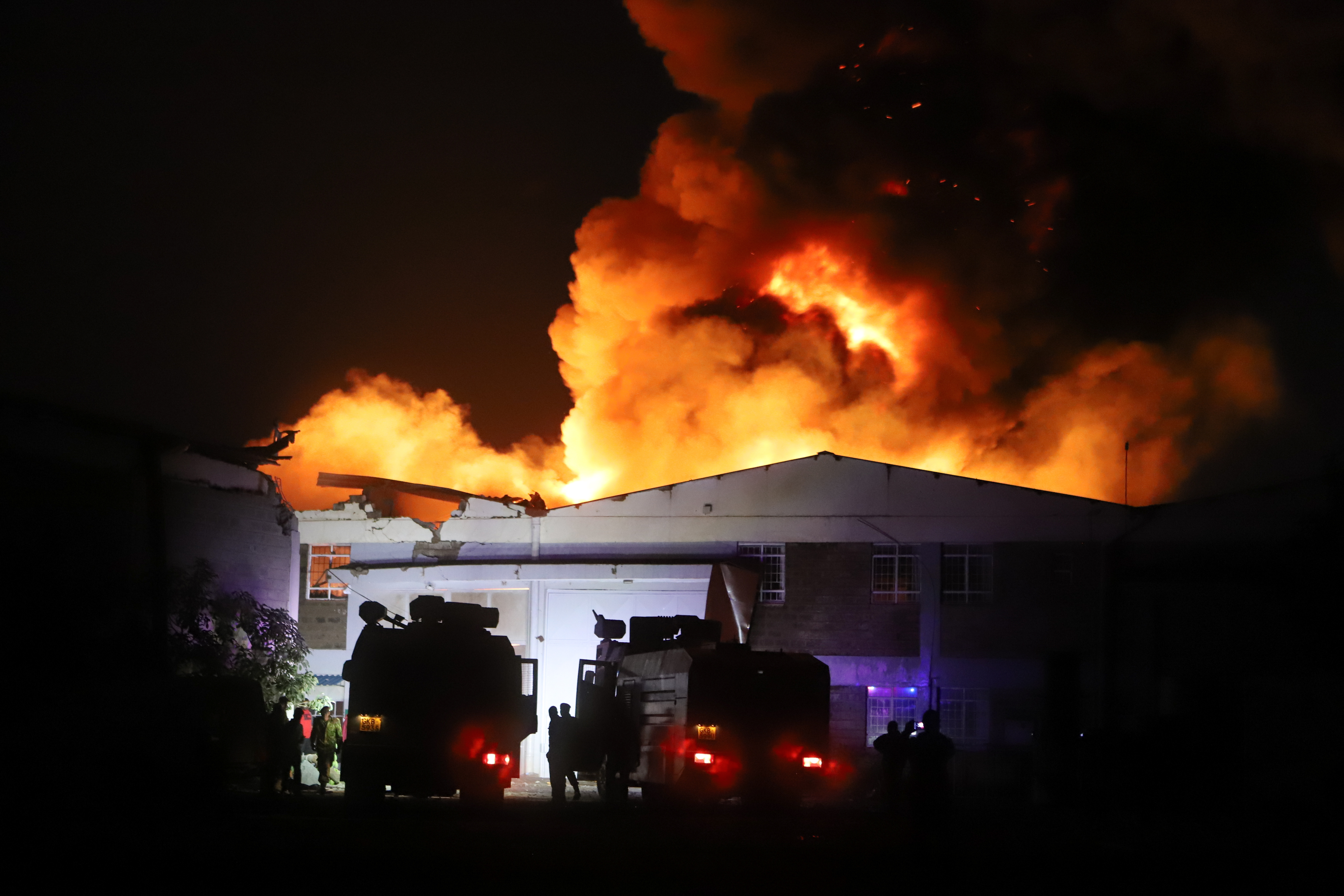 Firefighters watched the fire as it took over the sky late into the night