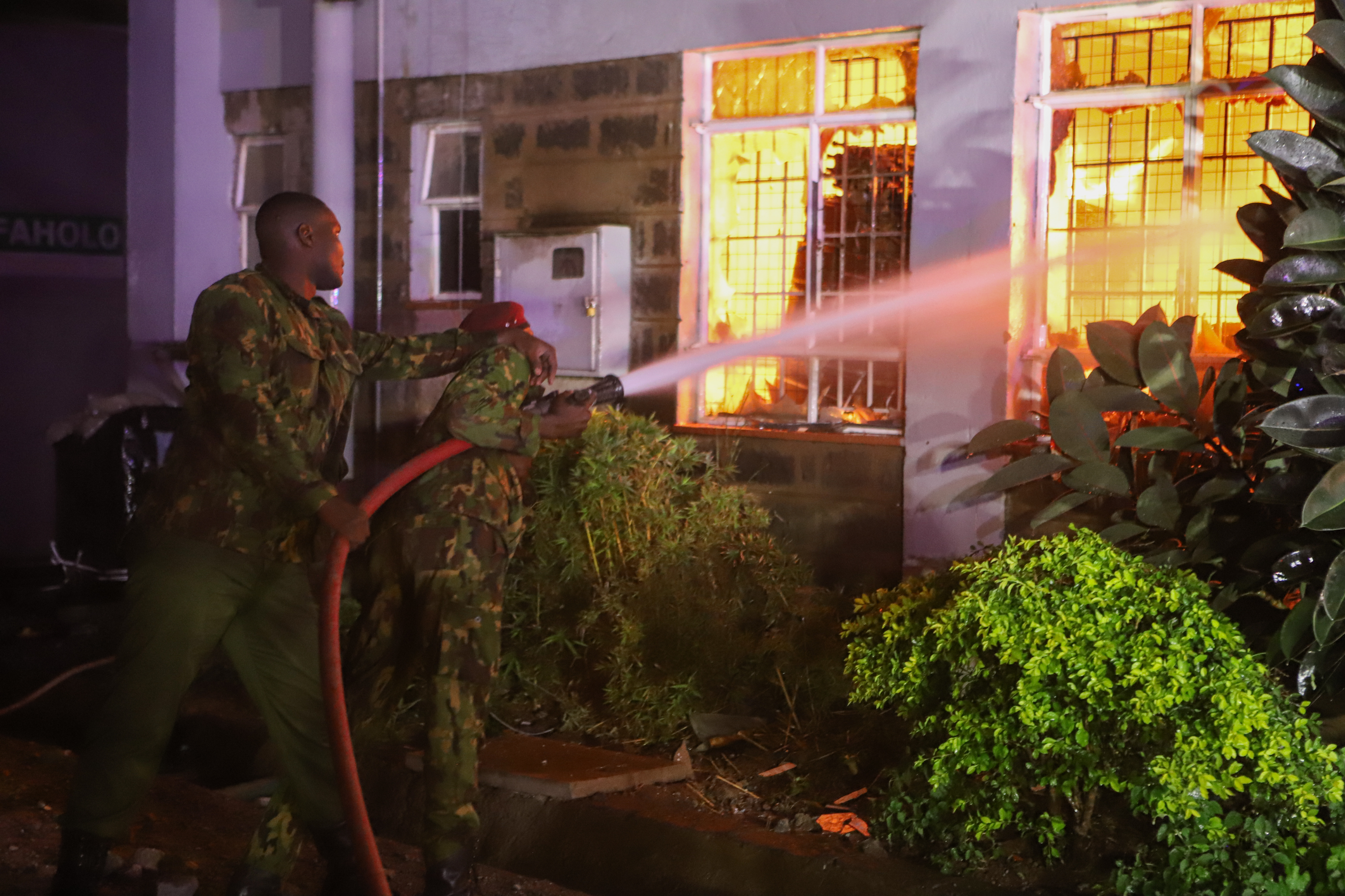 Firefighters were seen putting out the fires that had broke through into buildings
