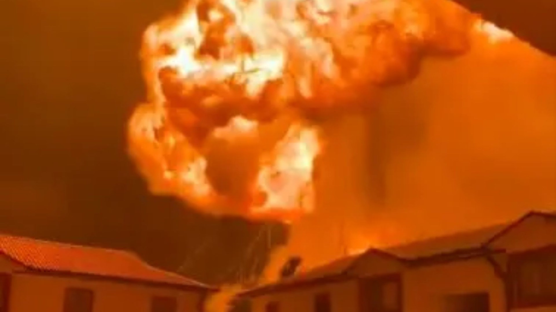 Terrifying mushroom cloud of flames erupts yards away from condo blocks in Kenya as terrified residents flee
