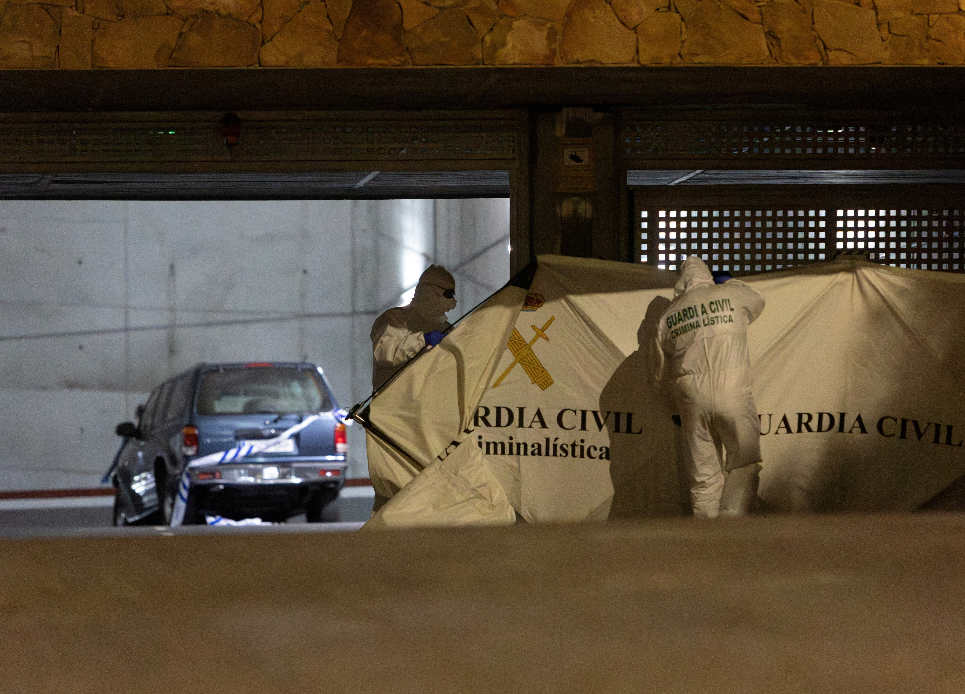 Spanish Civil Guard officers investigate the garage Kuzminov's bullet-riddled body was found