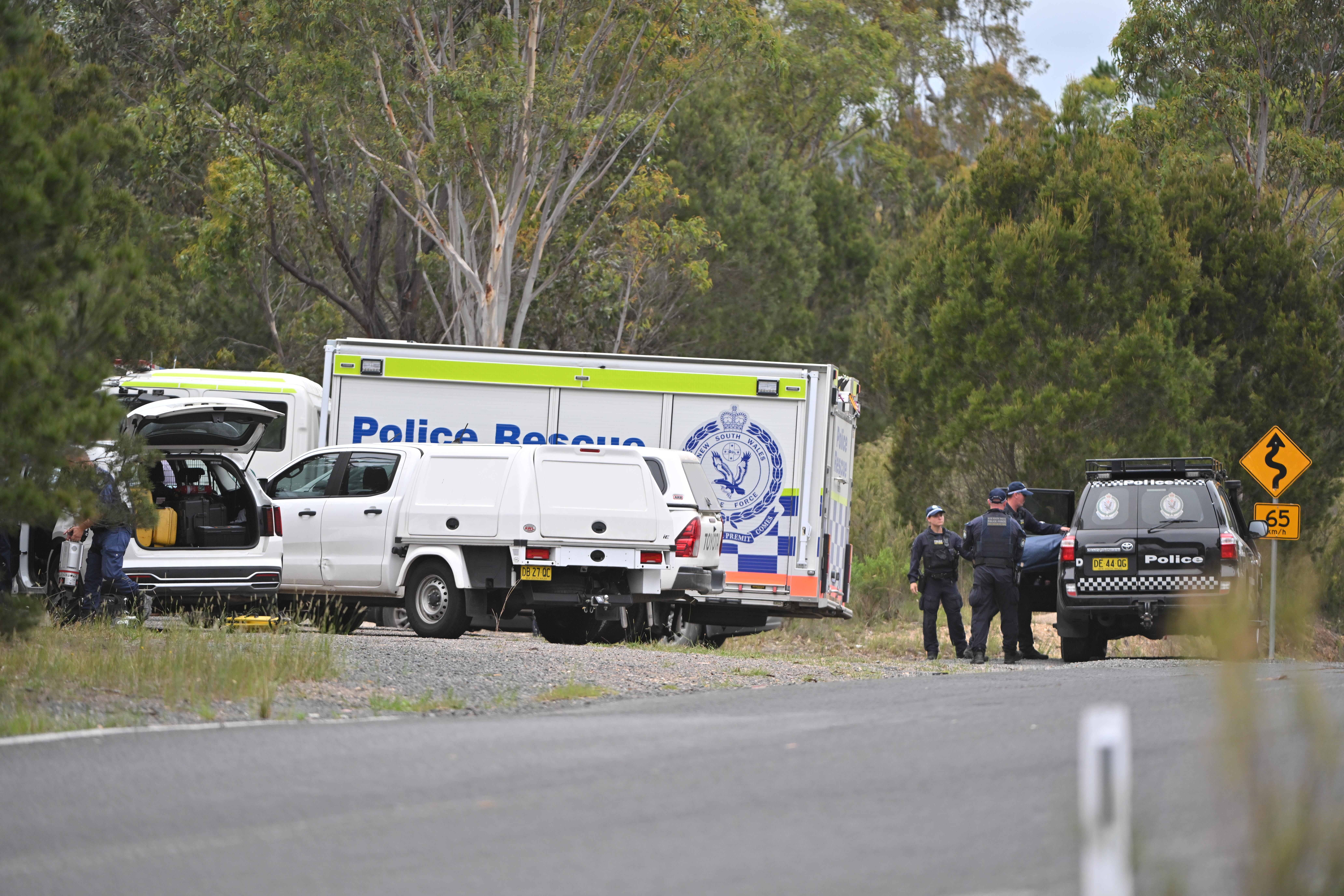 Police seen searching a rural property in Bungonia, two hours outside of Sydney, where the remains were found