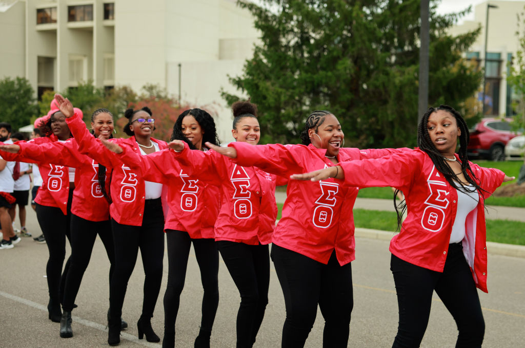 Members of Delta Sigma Theta sorority dance during the...