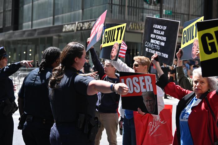 People gather outside Manhattan Criminal Court during the jury's deliberation on former President Donald Trump's hush money case. The jury found him guilty of 34 counts of falsifying business documents on Thursday, May 30, 2024.