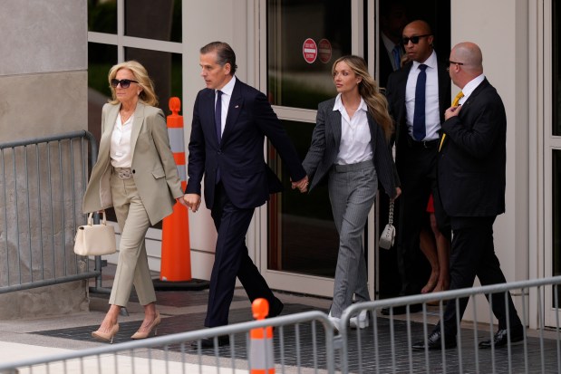 Hunter Biden, President Joe Biden's son, accompanied by his mother, first lady Jill Biden and his wife, Melissa Cohen Biden, walks out of federal court after hearing the verdict, Tuesday, June 11, 2024, in Wilmington, Del. Hunter Biden has been convicted of all 3 felony charges in the federal gun trial. (AP Photo/Matt Slocum)