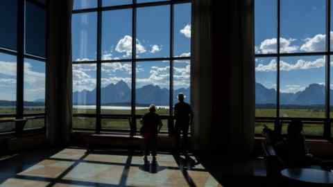 The Teton mountain range seen through a window